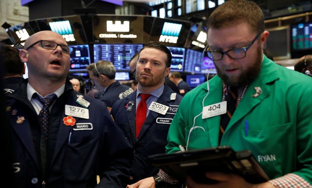 Workers work on the floor of New York Stock Exchange , February 16, 2018 - Reuters/ Lucas Jackson 