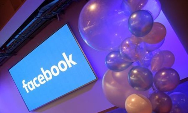 Balloons are seen in front of a logo at Facebook's headquarters in London, Britain, December 4, 2017. REUTERS/Toby Melville/File Photo 