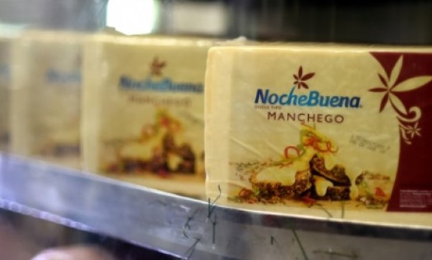 Manchego cheese on display at a wholesale market in Mexico City - AFP / AFP / by Laurence BOUTREUX