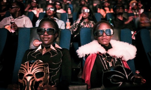 Fans watch the film "Black Panther" in 3D during a cosplay screening in Nairobi, Kenya