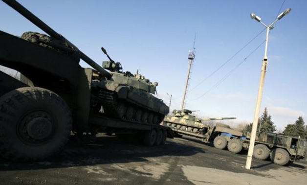 Ukrainian forces ride tanks on the road from Artemivsk to Debaltseve, in the Donetsk region, in February 2015 - AFP 