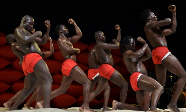 Contemporary dancers from Burkina Faso's "Les clameurs des arenes" company, perform during the 9th edition of the MASA festival in Abidjan