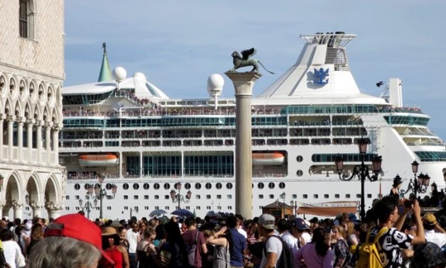 FILE PHOTO: A cruise ship is seen in Venice lagoon passing beside the Piazetta next to the Piazza San Marco (St.Mark's square) in Venice, Italy, June 18, 2016. REUTERS/Fabrizio Bensch /File Photo