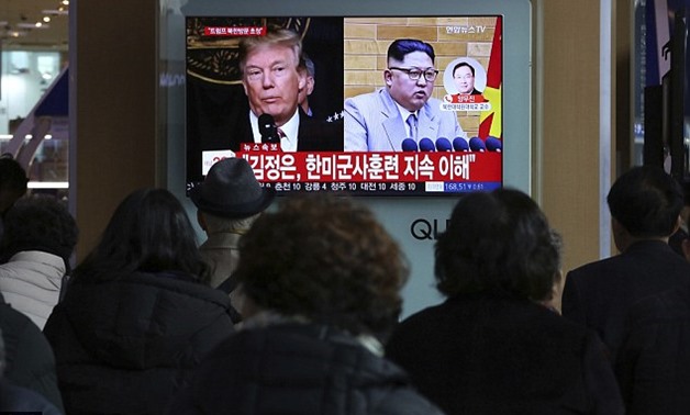 People watch a TV screen showing North Korean leader Kim Jong Un and U.S. President Donald Trump at the Seoul Railway Station in South Korea on Thursday following the announcement



Read more: http://www.dailymail.co.uk/news/article-5480785/Trump-Pre