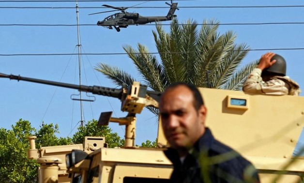 Military forces and helicopters secure an area in North Sinai, Egypt, December 1, 2017. Picture taken December 1, 2017 - REUTERS/Mohamed Abd El Ghany