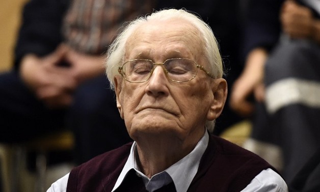 Convicted former SS officer Oskar Groening listens to the verdict of his trial on July 15 - AFP
