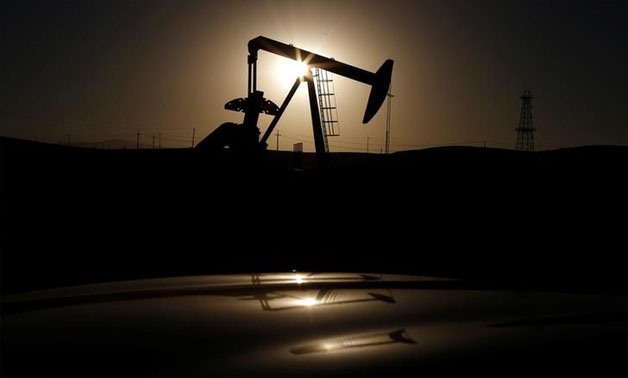 A pump jack is seen at sunrise near Bakersfield, California October 14, 2014. REUTERS/Lucy Nicholson/File Photo