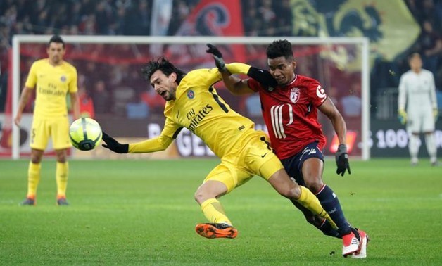 Lille’s Thiago Mendes in action with Paris Saint-Germain’s Javier Pastore. REUTERS/Charles Platiau

