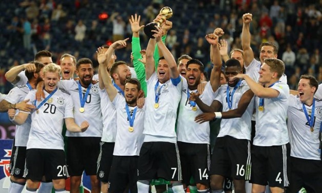 Soccer Football - Chile v Germany - FIFA Confederations Cup Russia 2017 - Final - Saint Petersburg Stadium, St. Petersburg, Russia - July 2, 2017 Germany’s Julian Draxler celebrates with the trophy and teammates after winning the FIFA Confederations Cup R