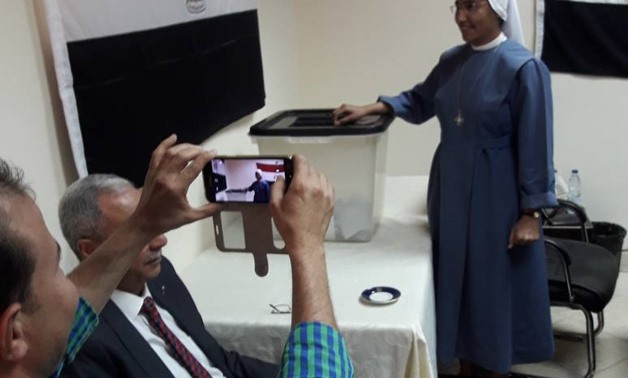 FILE: A Sudan-based Egyptian nun casts his ballot in the Egyptian Embassy's polling station