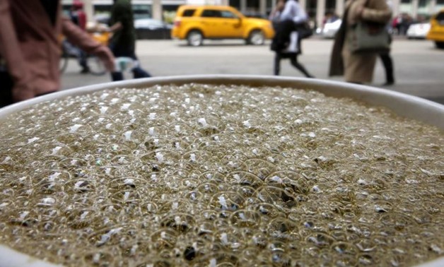 Bubbles form on the surface of a cup of coffee in a cafe in New York, April 11, 2014. REUTERS/Carlo Allegri/File Photo

