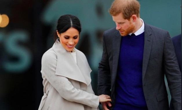 
Britain's Prince Harry, and his fiancee Meghan Markle, leave after a visit to the Titanic tourist attraction in Belfast, Northern Ireland March 23, 2018. REUTERS/Darren Staples