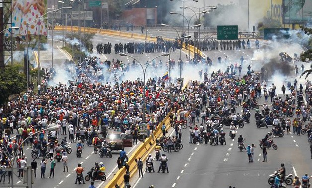 Protesters clash with riot police in Caracas, Venezuela on April 10, 2017 - Reuters