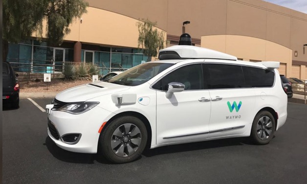 FILE PHOTO: A Waymo self-driving vehicle is parked outside the Alphabet company's offices where its been testing autonomous vehicles in Chandler, Arizona, U.S., March 21, 2018. REUTERS/Heather Somerville/File Photo