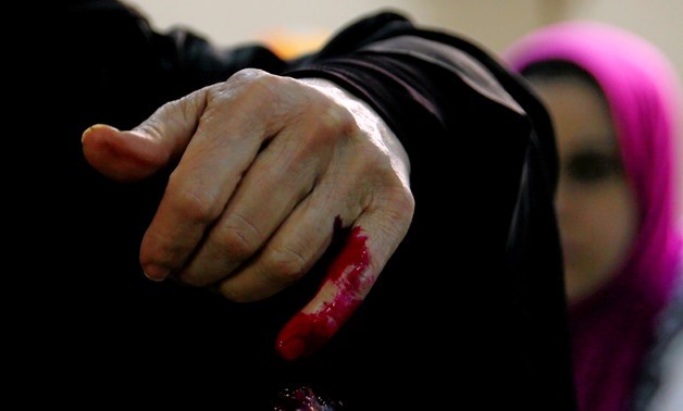 An Egyptian woman has her finger stained with ink after casting her vote during the first day of the presidential election at a polling station in Cairo, Egypt, March 26, 2018. REUTERS/Amr Abdallah Dalsh
