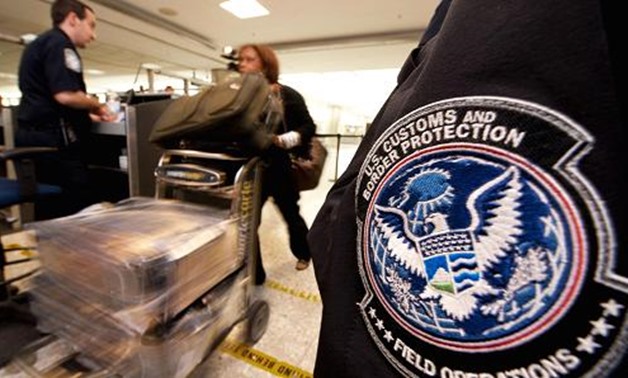 An international air traveler is cleared by a U.S. Customs and Border Protection Officer inside the U.S. Customs and Immigration area at Dulles International Airport.
- Reuters