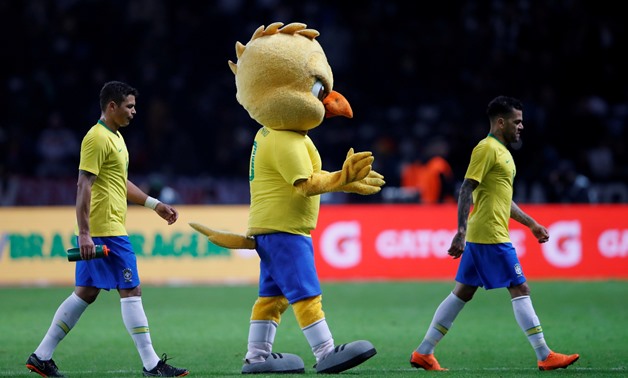 Soccer Football - International Friendly - Germany vs Brazil - Olympiastadion, Berlin, Germany - March 27, 2018 Brazil mascot celebrates on the pitch with Brazil's Thiago Silva and Dani Alves after the match REUTERS/Wolfgang Rattay TPX IMAGES OF THE DAY
