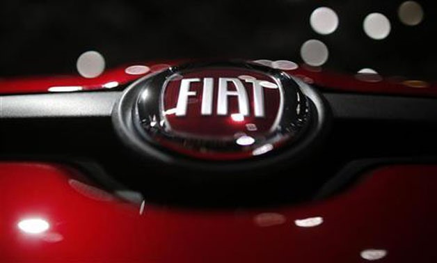 A company logo is seen on a Fiat car displayed on media day at the Paris Mondial de l'Automobile, September 28, 2012. REUTERS/Christian Hartmann