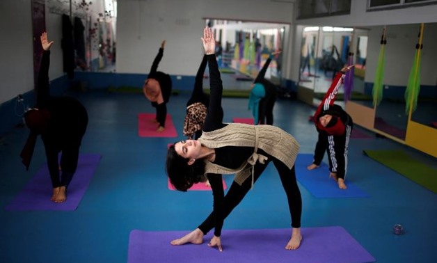 Palestinian women take part in a yoga session in Gaza City March 28, 2018. REUTERS/Mohammed Salem