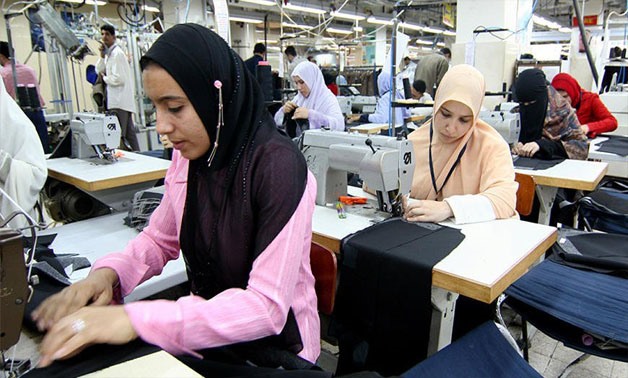 Women work in a factory that makes men's suits in 10th of Ramadan City, Egypt, Feb. 22, 2006 - Reuters
