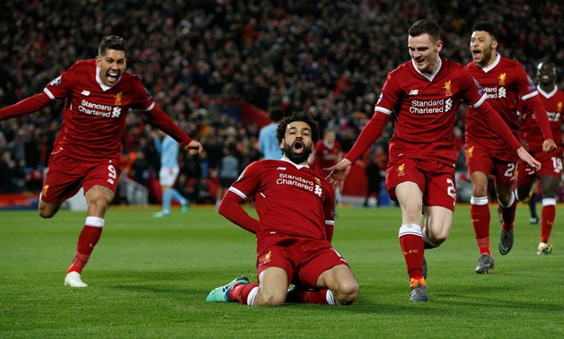 Soccer Football - Champions League Quarter Final First Leg - Liverpool vs Manchester City - Anfield, Liverpool, Britain - April 4, 2018 Liverpool's Mohamed Salah celebrates with Roberto Firmino and Andrew Robertson scoring their first goal REUTERS/Andrew 