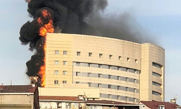 Flames and black smoke engulf a hospital building in the Gaziosmanpasa district of Istanbul, on April 5, 2018
