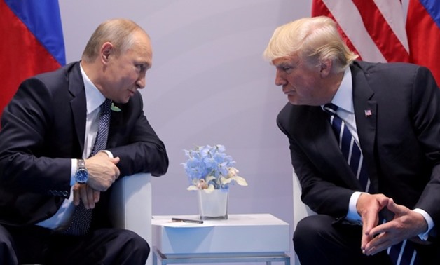 U.S. slaps sanctions on Putin cronies for Russia's 'malign activity' | Reuters
