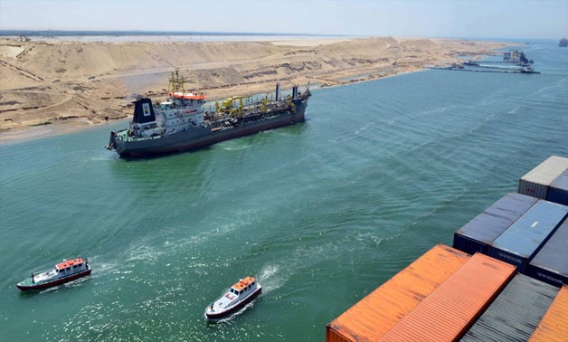 A cargo ship is seen crossing through the New Suez Canal, Ismailia, Egypt, July 25, 2015. - Reuters