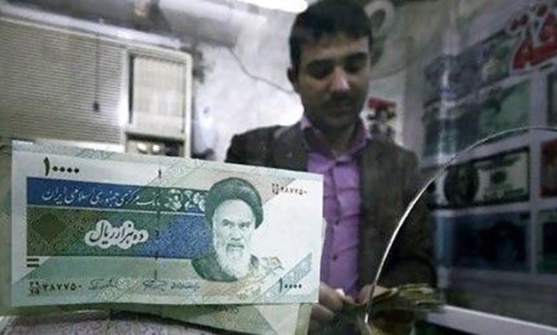 FILE PHOTO: Iranian rial banknotes are seen at a currency exchange shop in Kerbala, 110 km (70 miles) south of Baghdad January 27, 2012. REUTERS/Mushtaq Muhammed
