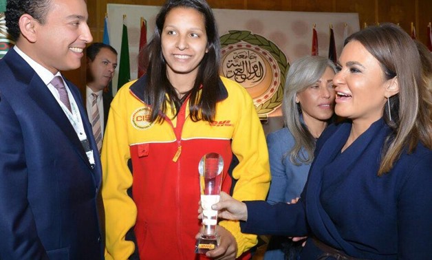 Egyptian minister of investment Sahar Nasr with first female courier in DHL - press photo