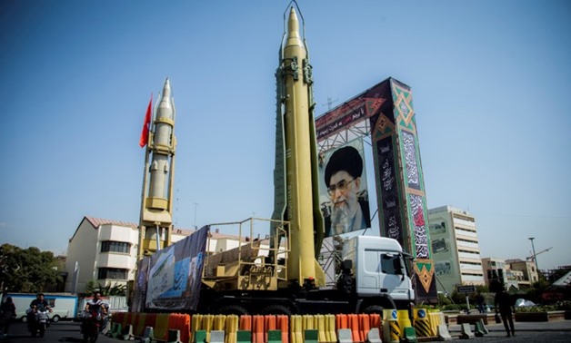 FILE PHOTO: A display featuring missiles and a portrait of Iran's Supreme Leader Ayatollah Ali Khamenei is seen at Baharestan Square in Teh - Reuters
