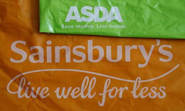 Shopping bags from Asda and Sainsbury's are seen in Manchester, Britain April 30, 2018. REUTERS/Phil Noble/illustration