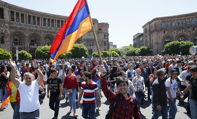 Armenian opposition supporters dance on the street after protest movement leader Nikol Pashinyan announced a nationwide campaign of civil disobedience in Yerevan, Armenia May 2, 2018. REUTERS/Gleb Garanich
