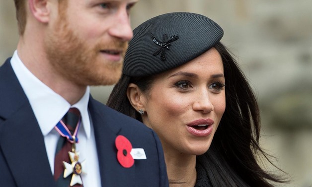 Britain's Prince Harry and his fiancee Meghan Markle attend a Service of Thanksgiving and Commemoration on ANZAC Day at Westminster Abbey in London, Britain, April 25, 2018. Eddie Mulholland/Pool via Reuters