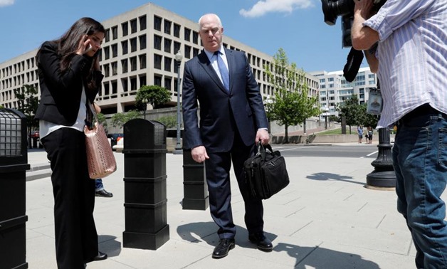 Lawyers Eric Dubelier and Katherine Seikaly leave U.S. District Court, following the arraignment of Concord Management and Consulting LLC, one of three entities and 13 Russian individuals indicted in an alleged criminal and espionage conspiracy to tamper 