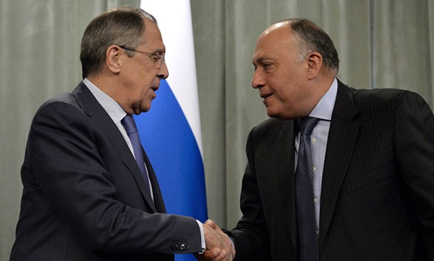 Egyptian Minister of Foreign Affairs, Sameh Shoukry, shakes hands with his Russian counterpart, Sergi Lavrov - AFP
