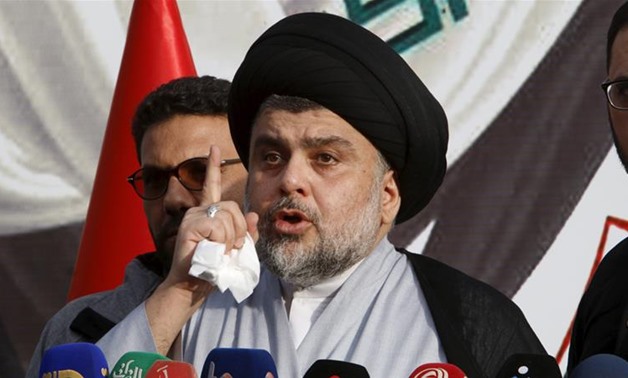 Muqtada al-Sadr speaks during a sit-in at the gates of the Green Zone. (Photo: Reuters/Khalid al-Mousily]
