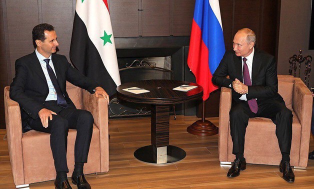 Syria’s President Basher al-Assad meet with Russia’s President Vladimir Putin in a surprise trip to Sochi resort on May 17, 2018 - Press Photo