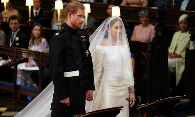 Prince Harry and Meghan Markle in St George's Chapel at Windsor Castle for their wedding in Windsor, Britain, May 19, 2018. Dominic Lipinski/Pool via REUTERS