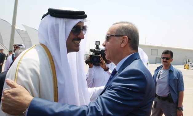 Turkish President Tayyip Erdogan is welcomed by Emir of Qatar Sheikh Tamim Bin Hamad Al-Thani in Doha, Qatar, July 24, 2017. REUTERS