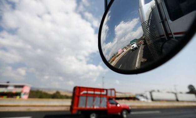 A truck is reflected in a rear-view mirror at Mexico-Puebla highway - Reuters 