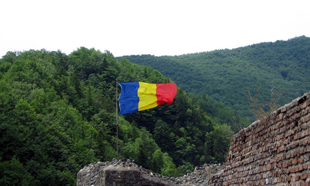 File: Romania Flag on the Poienari Fort, Argeș County, Romania – Flickr/andreistore