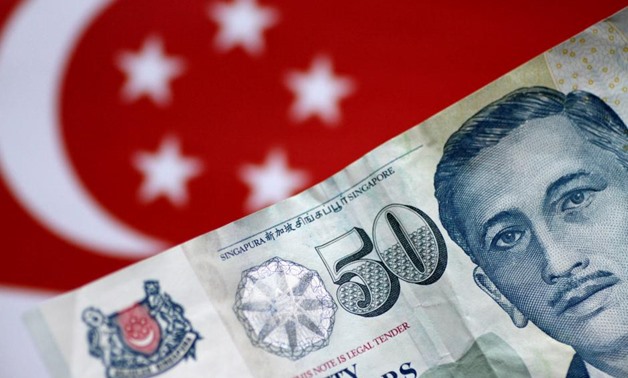 FILE PHOTO: A Singapore dollar note is seen in this illustration photo May 31, 2017. REUTERS/Thomas White/Illustration/File Photo