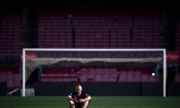 File- Andres Iniesta alone on the pitch after the game