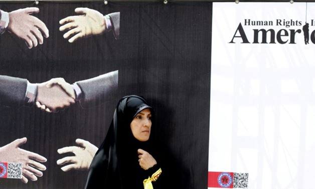 An anti-America poster is seen inside the former US embassy headquarters as Iranians take part in an anti-US demonstration in Tehran
