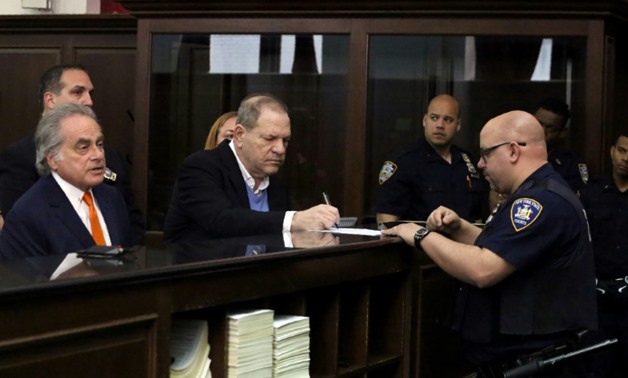 Disgraced Hollywood mogul Harvey Weinstein (C), at his arraignment in New York May 25, 2018 on rape and sex crimes charges
