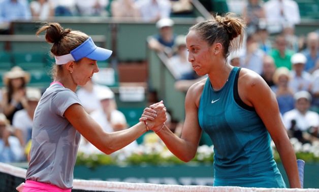 Tennis - French Open - Roland Garros, Paris, France - June 3, 2018 Madison Keys of the U.S. shakes hands with Romania's Mihaela Buzarnescu after winning their fourth round match REUTERS/Pascal Rossignol
