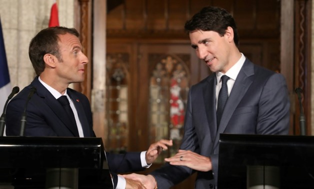 French President Emmanuel Macron (L) and Canadian Prime Minister Justin Trudeau (R) presented a common front in Ottawa before heading to the G7 summit
