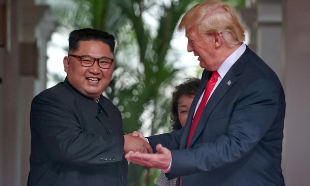 REFILE - ADDING RESTRICTIONS U.S. President Donald Trump meets North Korean leader Kim Jong Un at the Capella Hotel on Sentosa island in Singapore June 12, 2018. Kevin Lim/The Straits Times via REUTERS
