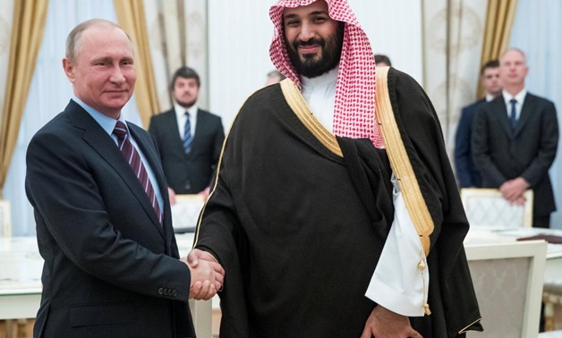Russian President Vladimir Putin shakes hands with Saudi Deputy Crown Prince and Defence Minister Mohammed bin Salman during a meeting at the Kremlin in Moscow, Russia, May 30, 2017. REUTERS/Pavel Golovkin/Pool
